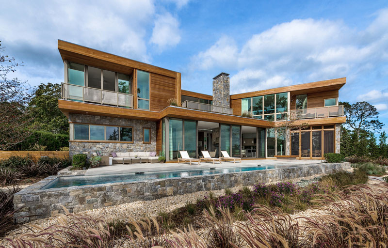 This wood and stone house overlooks the New York coastline