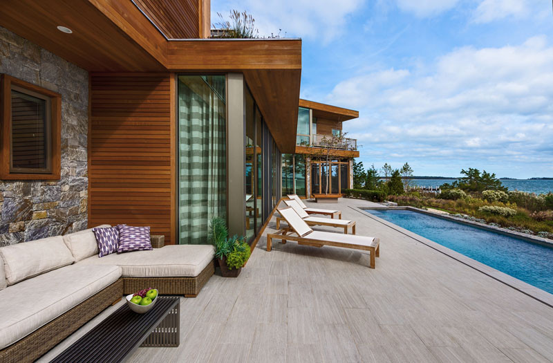 This wood and stone house overlooks the New York coastline