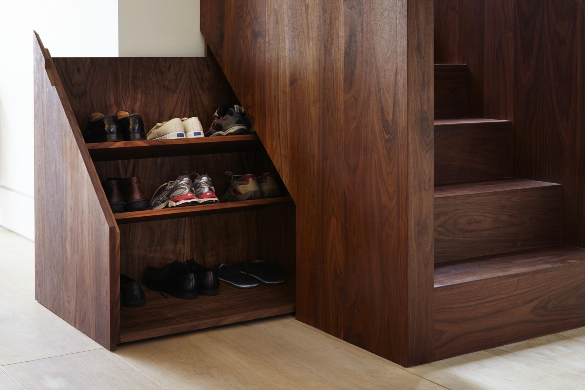 This hidden storage under the stairs almost seamlessly blends in unnoticed