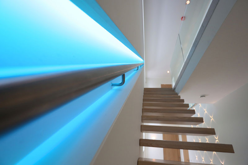 This staircase handrail has been designed to change colors using LED lights.