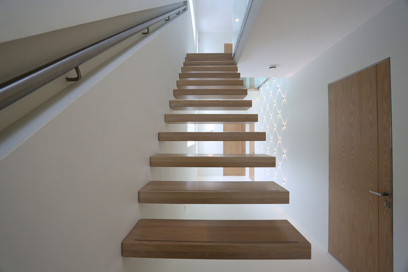 This staircase handrail has been designed to change colors using LED lights.