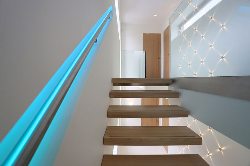 This staircase handrail has been designed to change colors using LED lights.