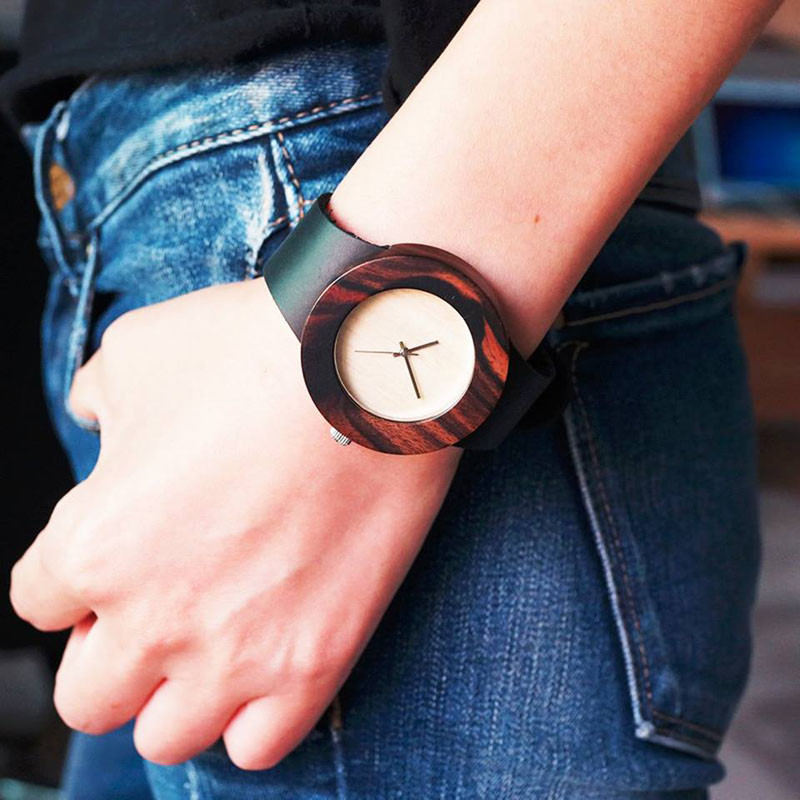 A modern ebony wood watch with a black leather strap. #ModenWoodWatches #Style #WoodWatches #Watches