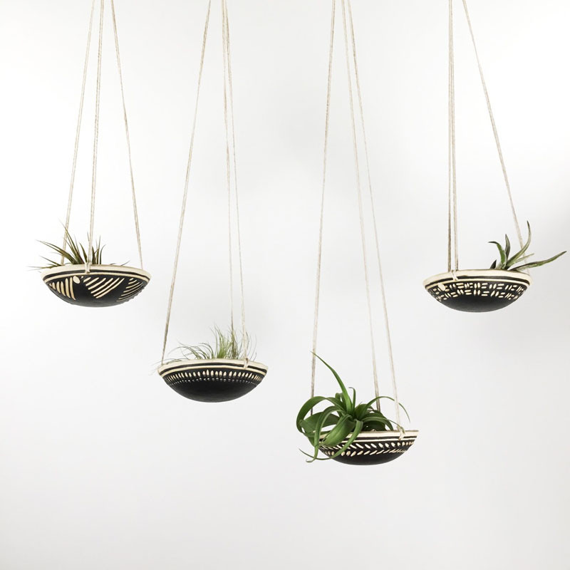 12 Elegant Ways To Bring Air Plants Into Your Home // These monochromatic hangers display your air plants from the ceiling. #AirPlants #ModernHomeDecor #Planters #ModernDecor