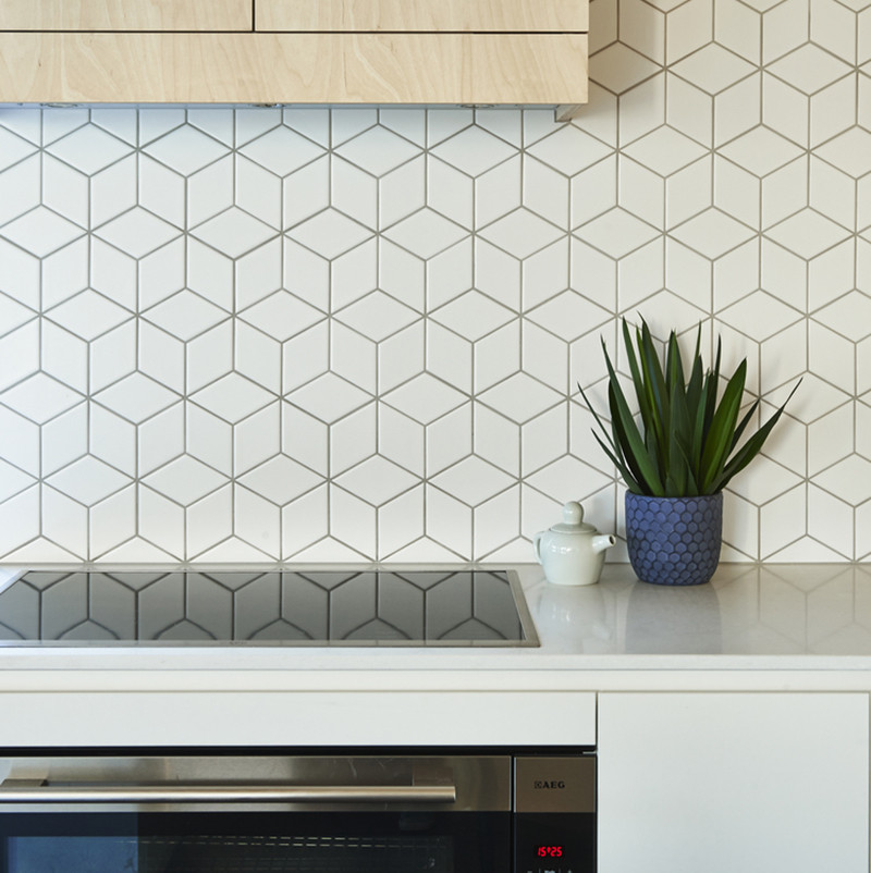 Tile is one of the most popular backsplash options out there. It's simple to install, easy to maintain, and comes in a huge range of colors, shapes, and sizes making it perfect for people who want to express their creativity in the kitchen. #TileBacksplash #KitchenBacksplash #KitchenDesign #BacksplashIDeas