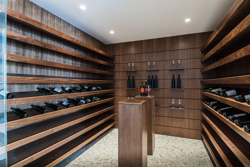 This cellar has plenty of shelves for displaying and storing wine.