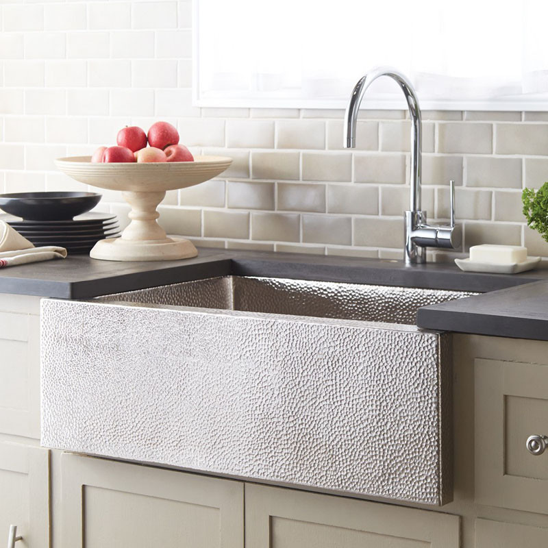 This nickel farmhouse sink adds a bit of texture to the kitchen.