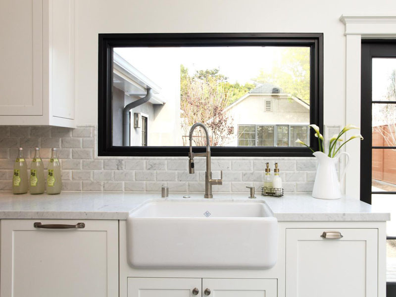 This farmhouse sink has a curved front base, which helps to soften the straight lines of a contemporary kitchen.