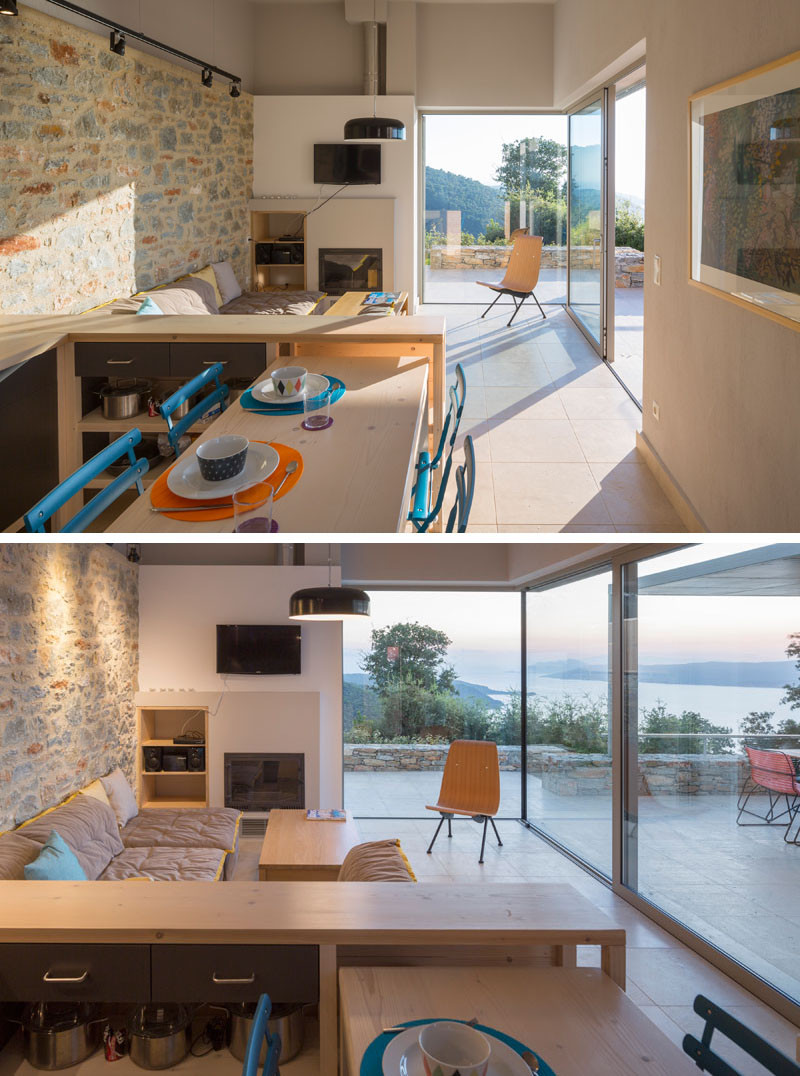 This living / kitchen area has floor-to-ceiling windows with picturesque sea views.