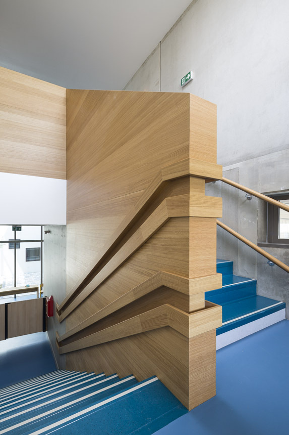 This daycare building has handrails for children and adults