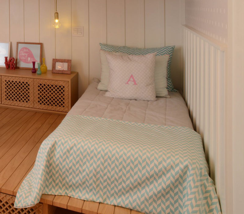This cute little girls bedroom has a lofted playspace