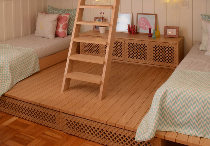 This cute little girls bedroom has a lofted playspace