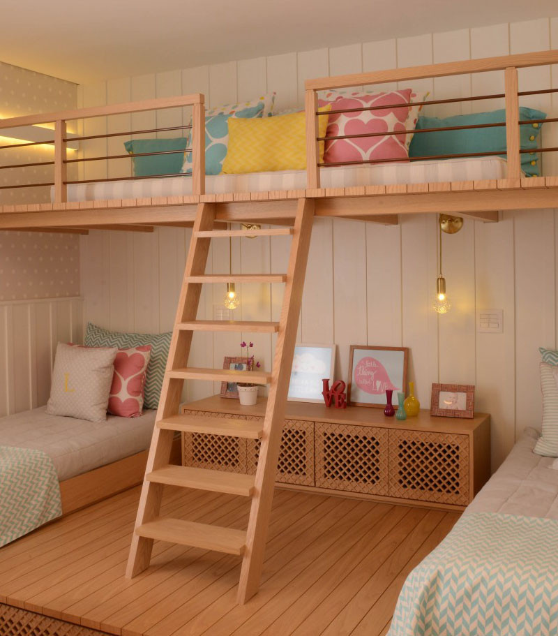 This cute little girls bedroom has a lofted playspace