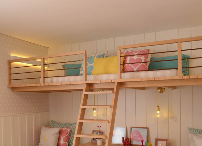 This cute little girls bedroom has a lofted playspace
