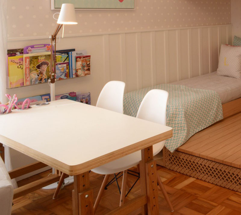 This cute little girls bedroom has a lofted playspace