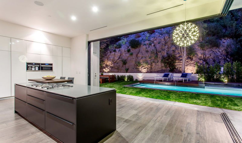 This kitchen opens up completely to the backyard, perfect for entertaining. 