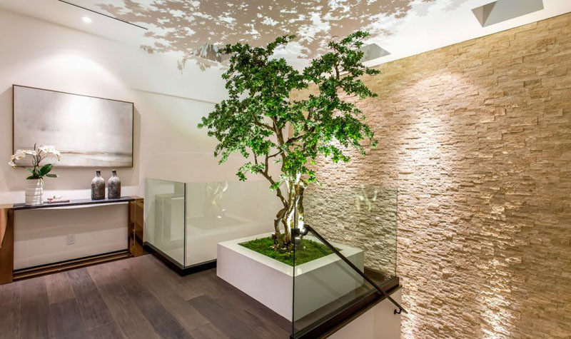 At the top of these stairs is a dedicated space for the custom bonsai tree, designed to definitely make a statement.