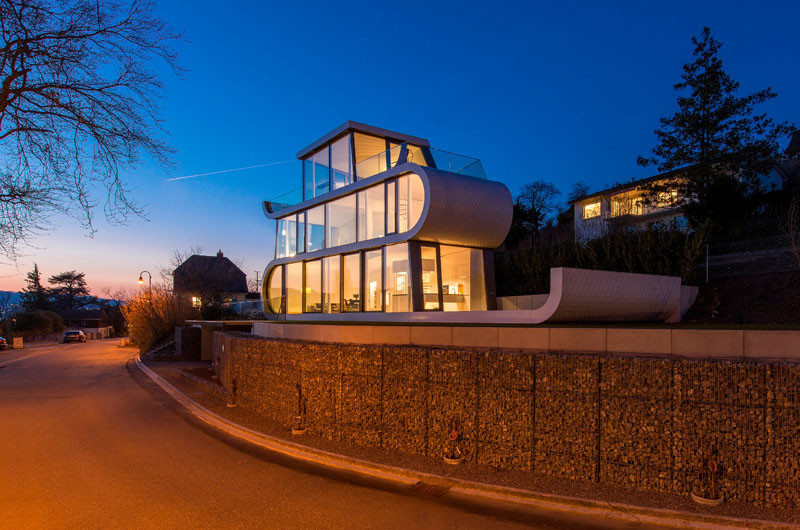 At night, this home in Switzerland lights up like a lantern.