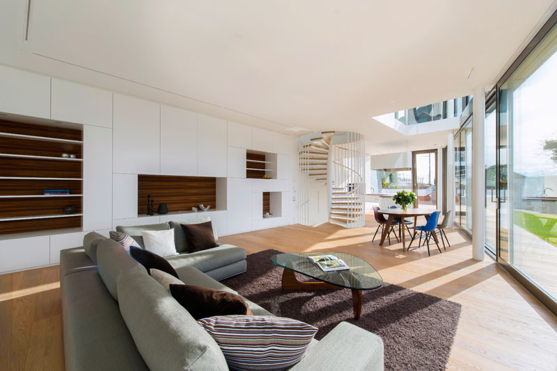 This living area has a large wall of built-in shelves.