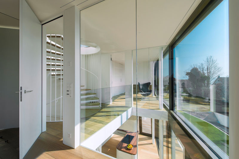 The stair landing in this home, has a void that allows you to look down into the living area on the floor below.