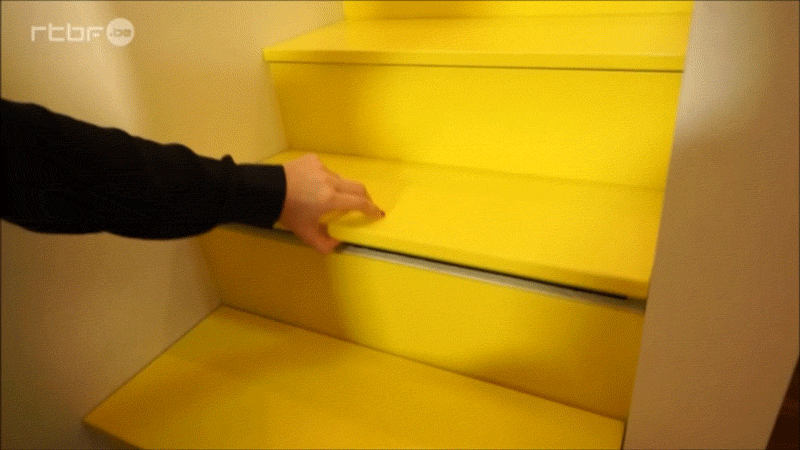 These Bright Yellow Stairs Include Hidden Spaces For Storage