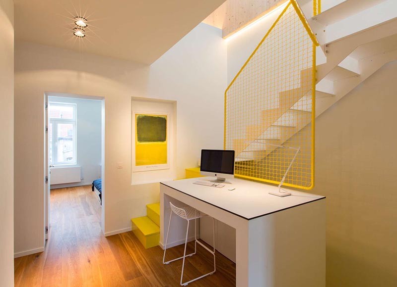 These Bright Yellow Stairs Include Hidden Spaces For Storage