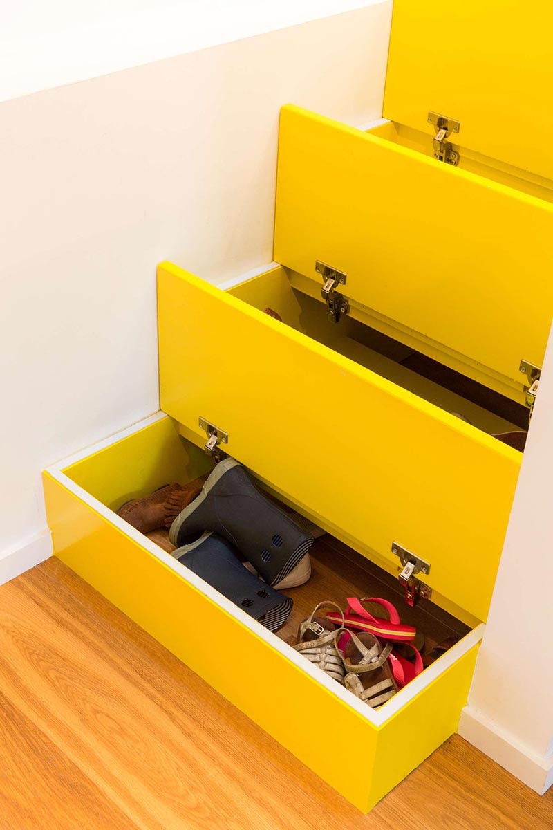 These Bright Yellow Stairs Include Hidden Spaces For Storage