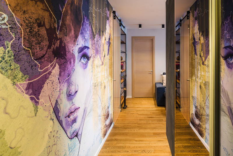 A Large Wall Mural Dominates This Apartment