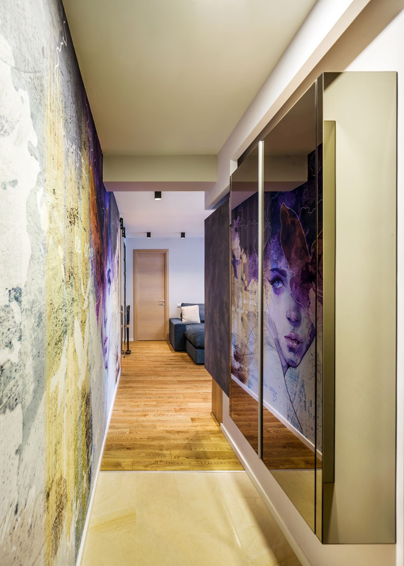 A Large Wall Mural Dominates This Apartment