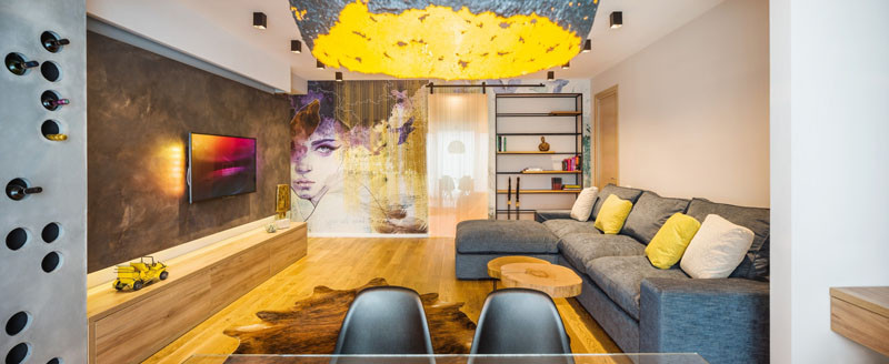 A Large Wall Mural Dominates This Apartment