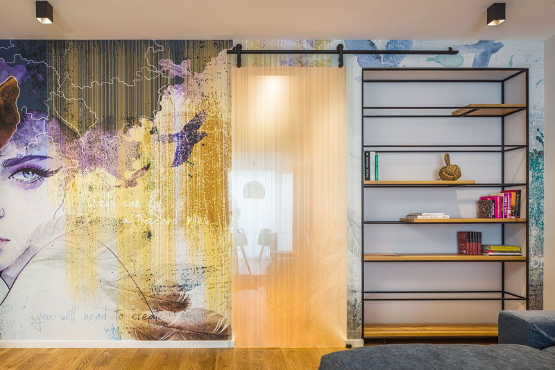 A Large Wall Mural Dominates This Apartment