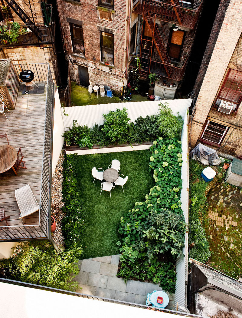 16 Inspirational Backyard Landscape Designs As Seen From Above // This backyard maximizes space with the patio above and the green space below. #Backyard #YardIdeas #LandscapingIdeas #YardLayout #YardDesign