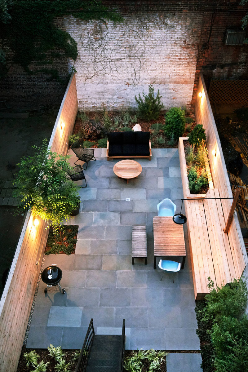 16 Inspirational Backyard Landscape Designs As Seen From Above // Entertaining can go late into the night with the built in lighting on this back patio. #Backyard #YardIdeas #LandscapingIdeas #YardLayout #YardDesign