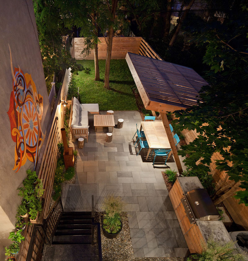 16 Inspirational Backyard Landscape Designs As Seen From Above // This backyard has an outdoor kitchen and covered dining area, as well as a lounge and fireplace. #Backyard #YardIdeas #LandscapingIdeas #YardLayout #YardDesign