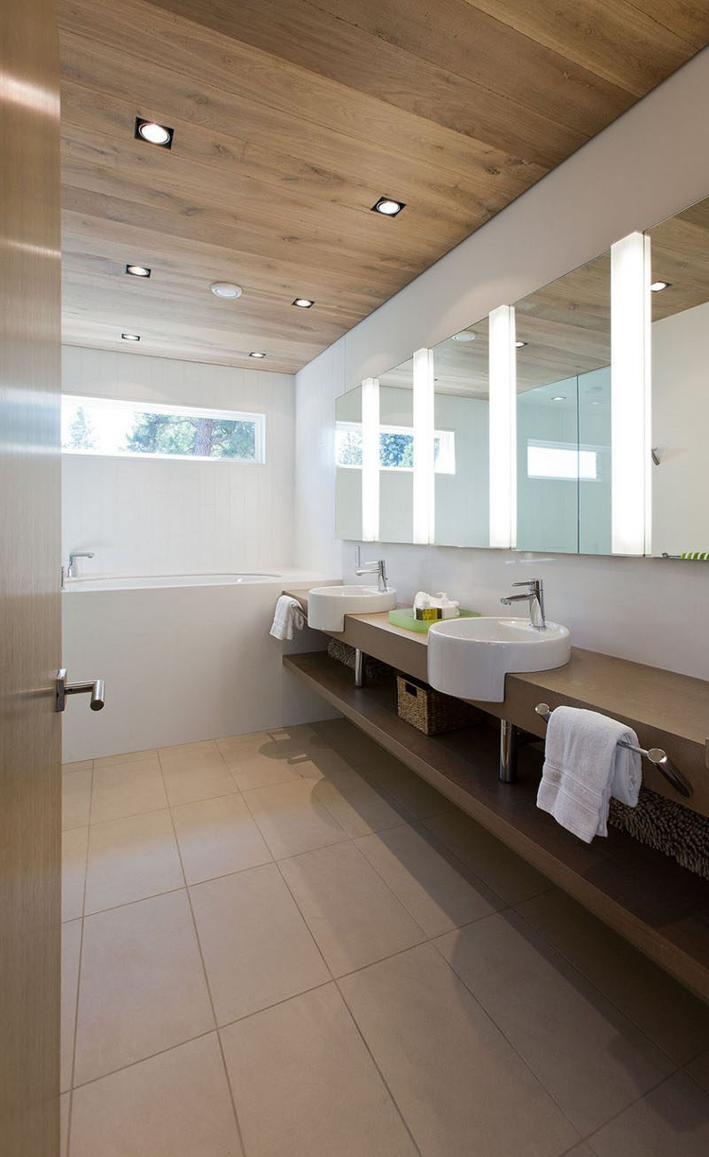 15 Examples of Bathroom Vanities That Have Open Shelving // The bathroom in this cabin has open shelving providing lots of extra storage space.