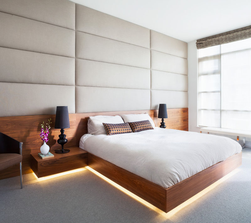 9 Bedrooms With Beds That Feature Hidden Lighting // This already bright bedroom added a strip of LED lights to the bottom of this bed for a warmer light.