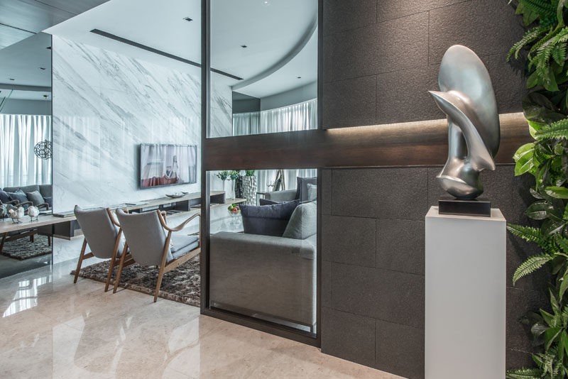 A sculptural element on a pedestal greets you as you enter this apartment.