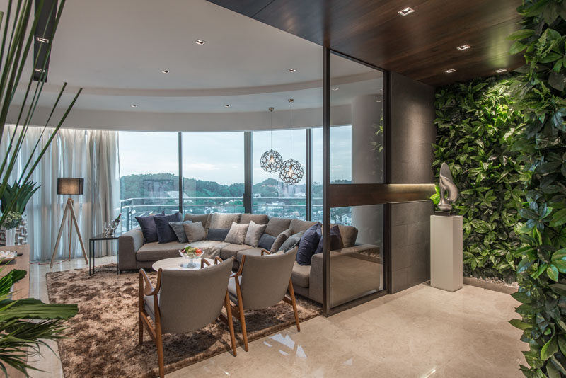 This living room has curved floor-to-ceiling windows to take advantage of the view.