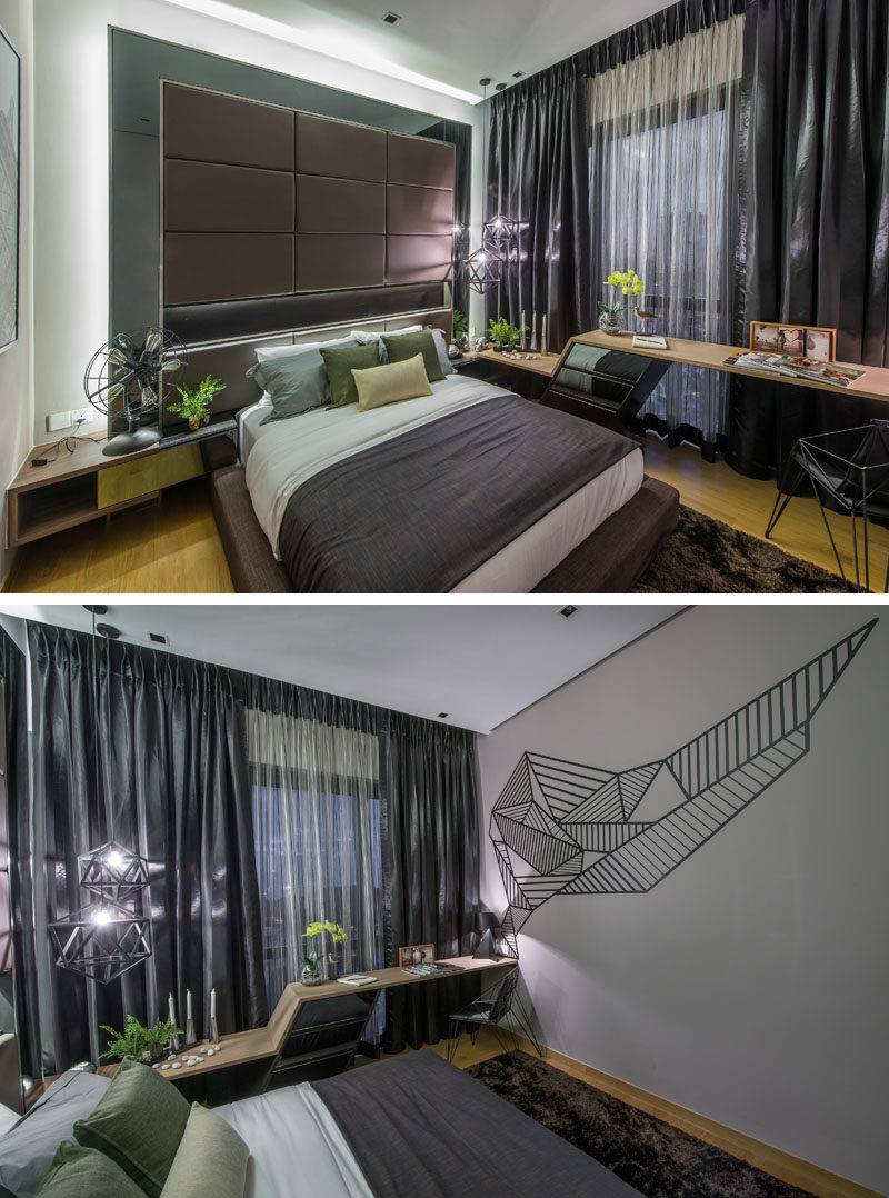 In this bedroom there is a custom designed desk against the window, and graphic art on the wall.