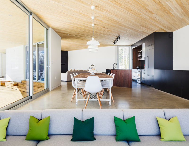 This open floor plan has a kitchen, dining area and a sunken living room.