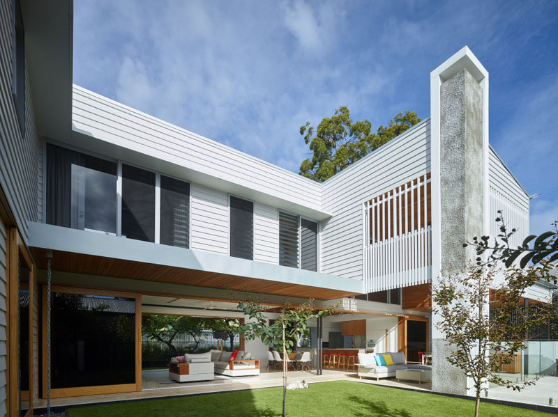 This home wraps around the backyard, with the living areas opening up to an outdoor lounge with a fireplace.