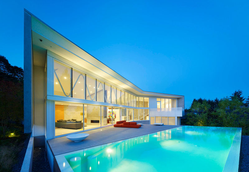 This home in Vancouver, Canada, has a large swimming pool and deck, perfect for entertaining.