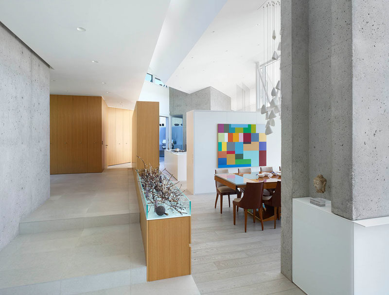 Upon entering this home, designed by BattersbyHowat Architects, the main floor has been split up into different areas, the living room, dining room and kitchen.