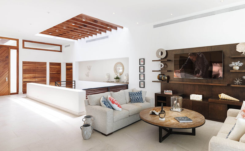 This living room area mixes light and dark woods.