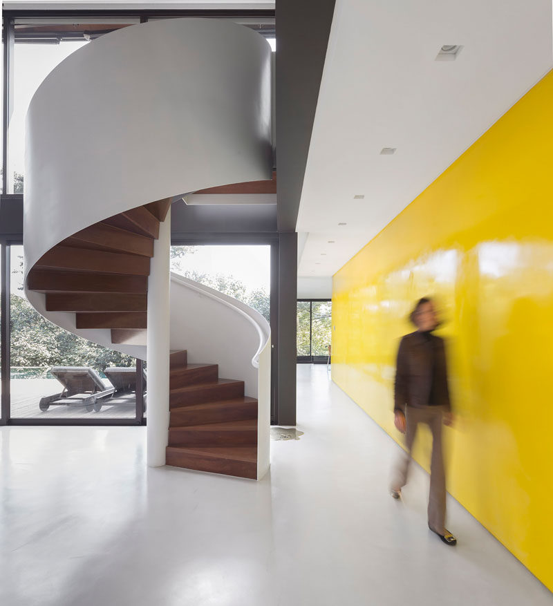 This spiral staircase mixes wood and white for a contemporary look.