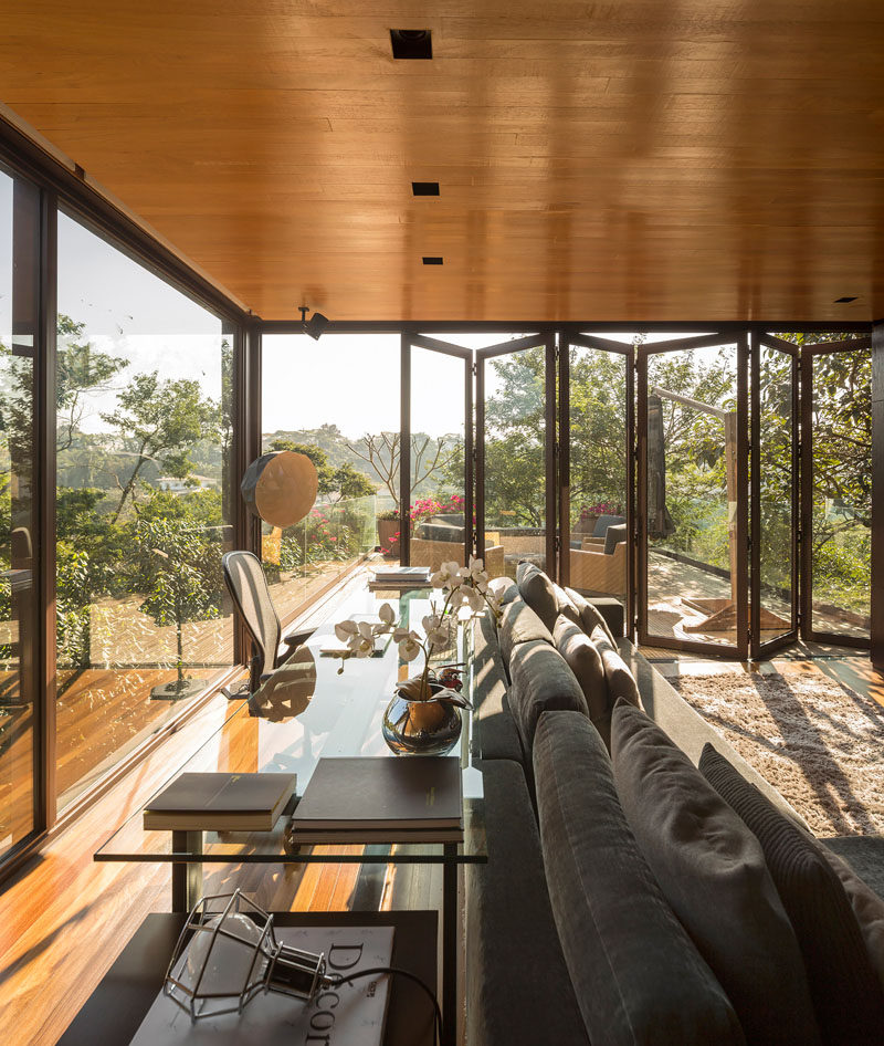 Folding glass doors can be opened to expand the living and games area of this home.