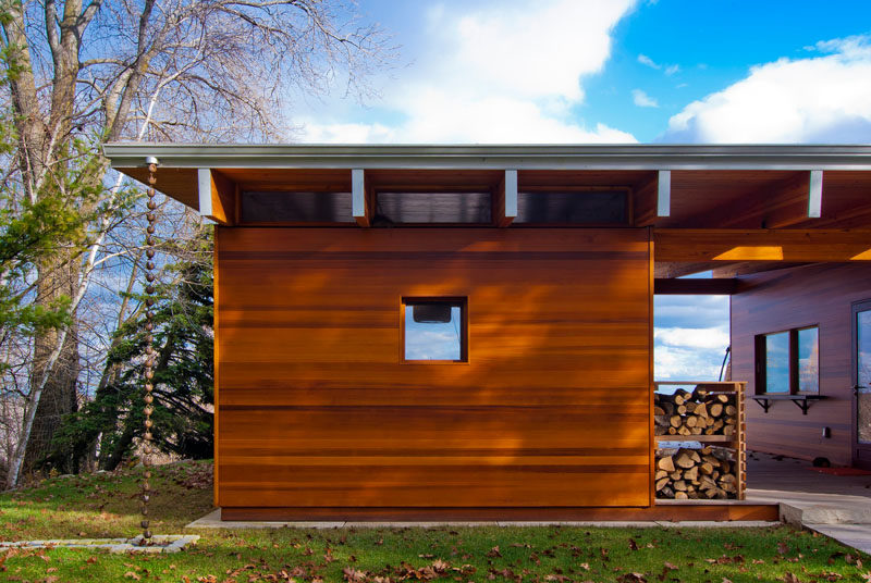 This beach cottage features a decorative rain chain, and dedicated firewood storage.