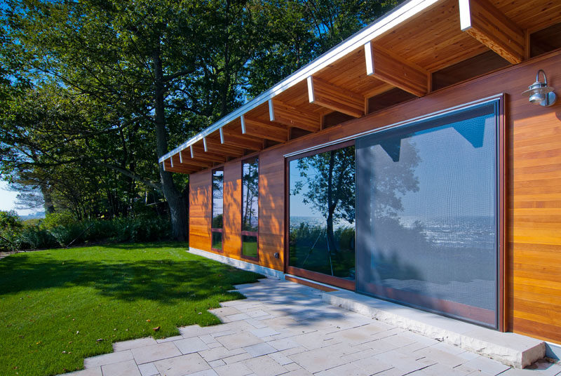 Large 16 foot sliding glass panels are located on each side of this cottage, allowing the interiors spaces to open to the outdoors.