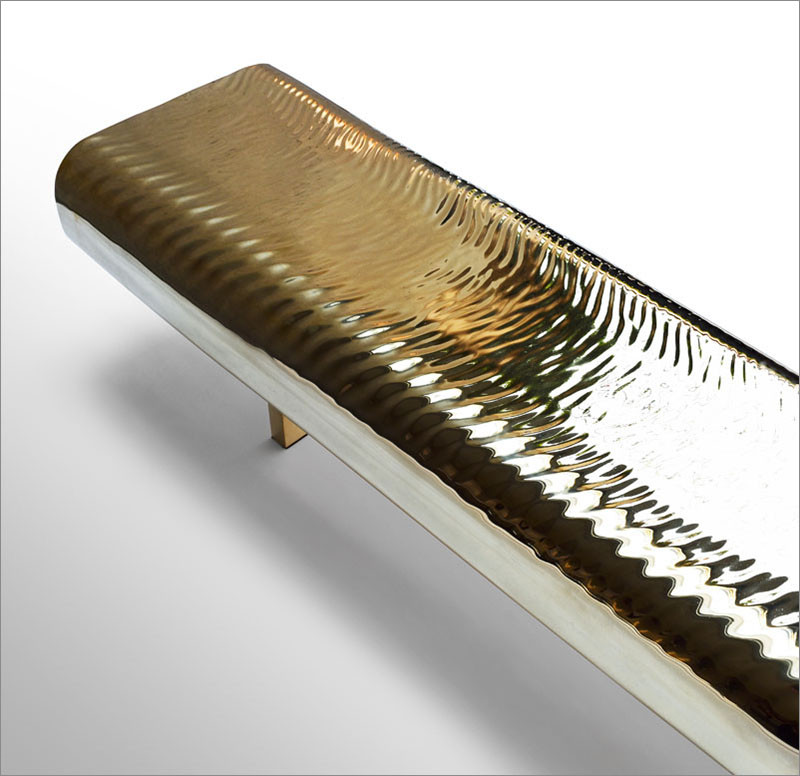 Golden Water-Like Ripples Cover This Brass Bench