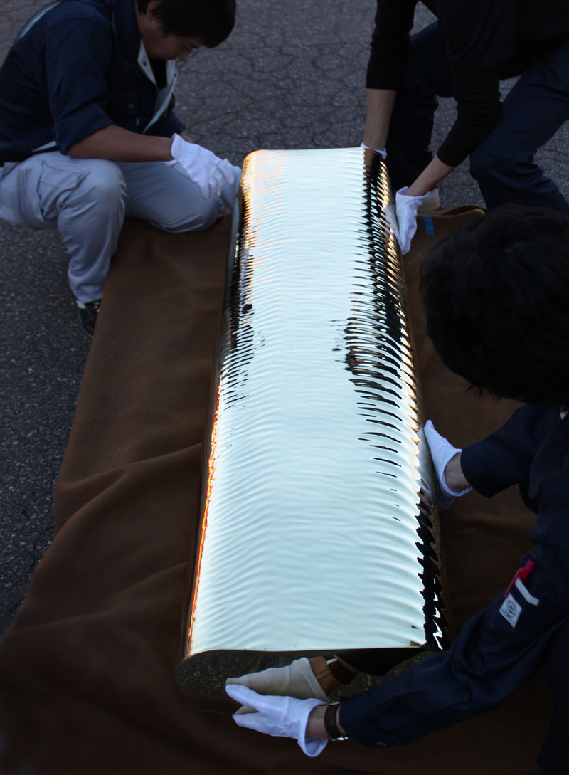 Golden Water-Like Ripples Cover This Brass Bench